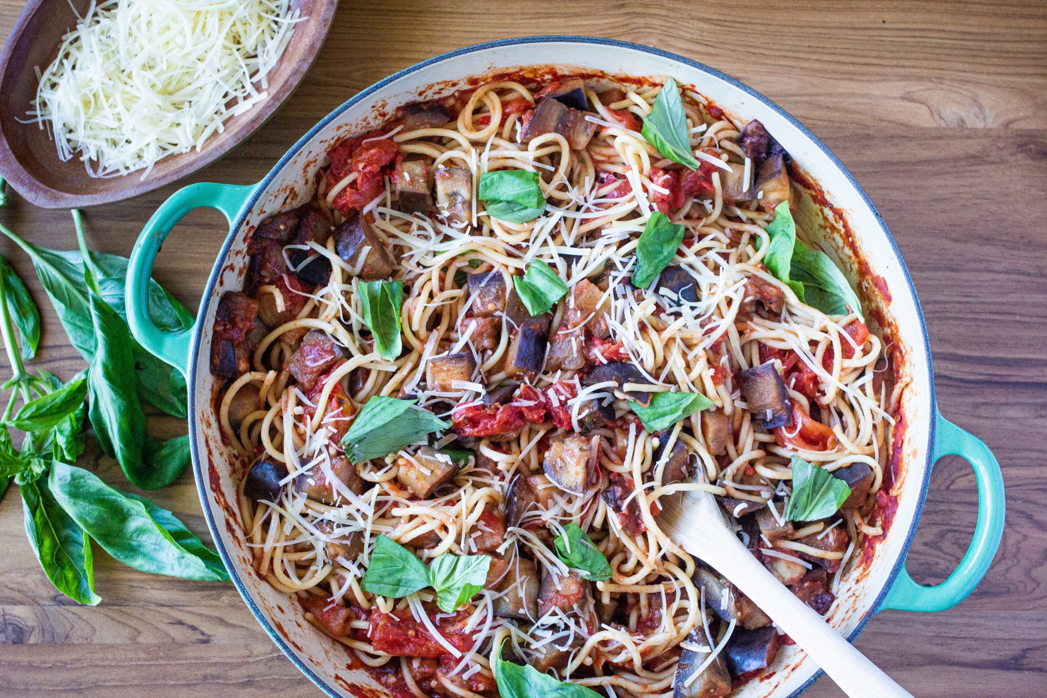 pasta with eggplant in a pot with wooden spoon