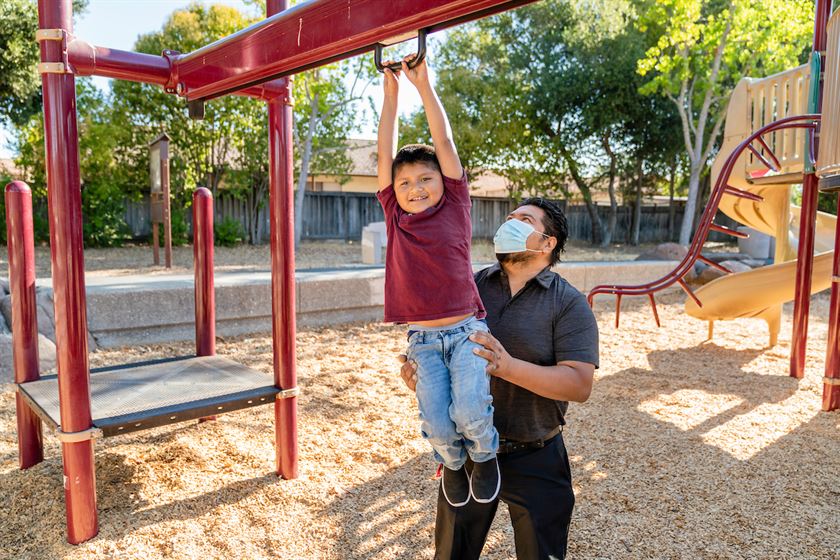 Oscar and his son Oscar Junior playing on the monkey bars