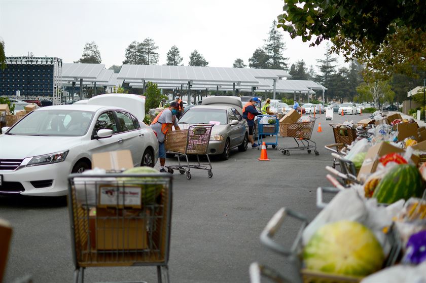 Cars loaded with boxes of food at drive thru distribution at Cathedral of Faith