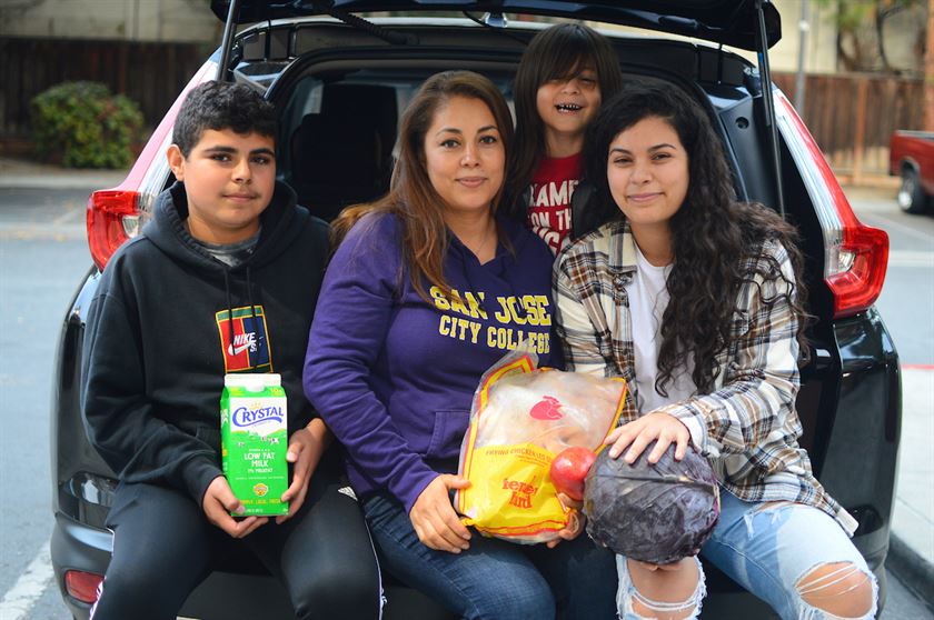 Elizabeth and her three kids are clients who visit Cathedral of Faith free grocery distribution for people who are food insecure in San Jose - They became clients in march of 2020