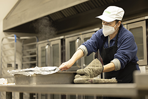 Team member preparing food trays